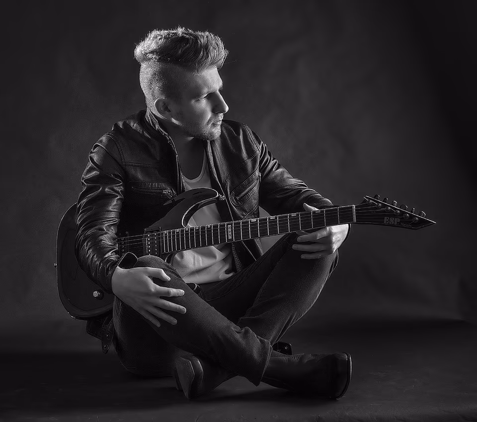 Kendall May guitar sitting